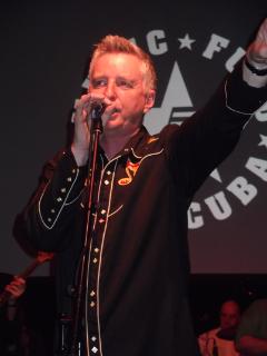 Billy Bragg performing at the tribute to Kirsty